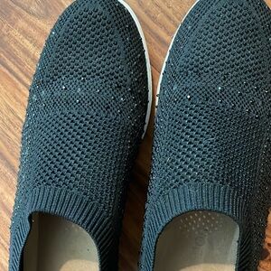 Black like new slip on casual shoes has bling on them!! Worn three times only .